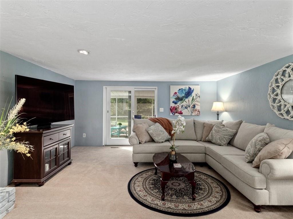360 Dappenbrook Drive Beaver, PA 15009 - Photo 9 of 30 a living room with furniture a flat screen tv and a large window