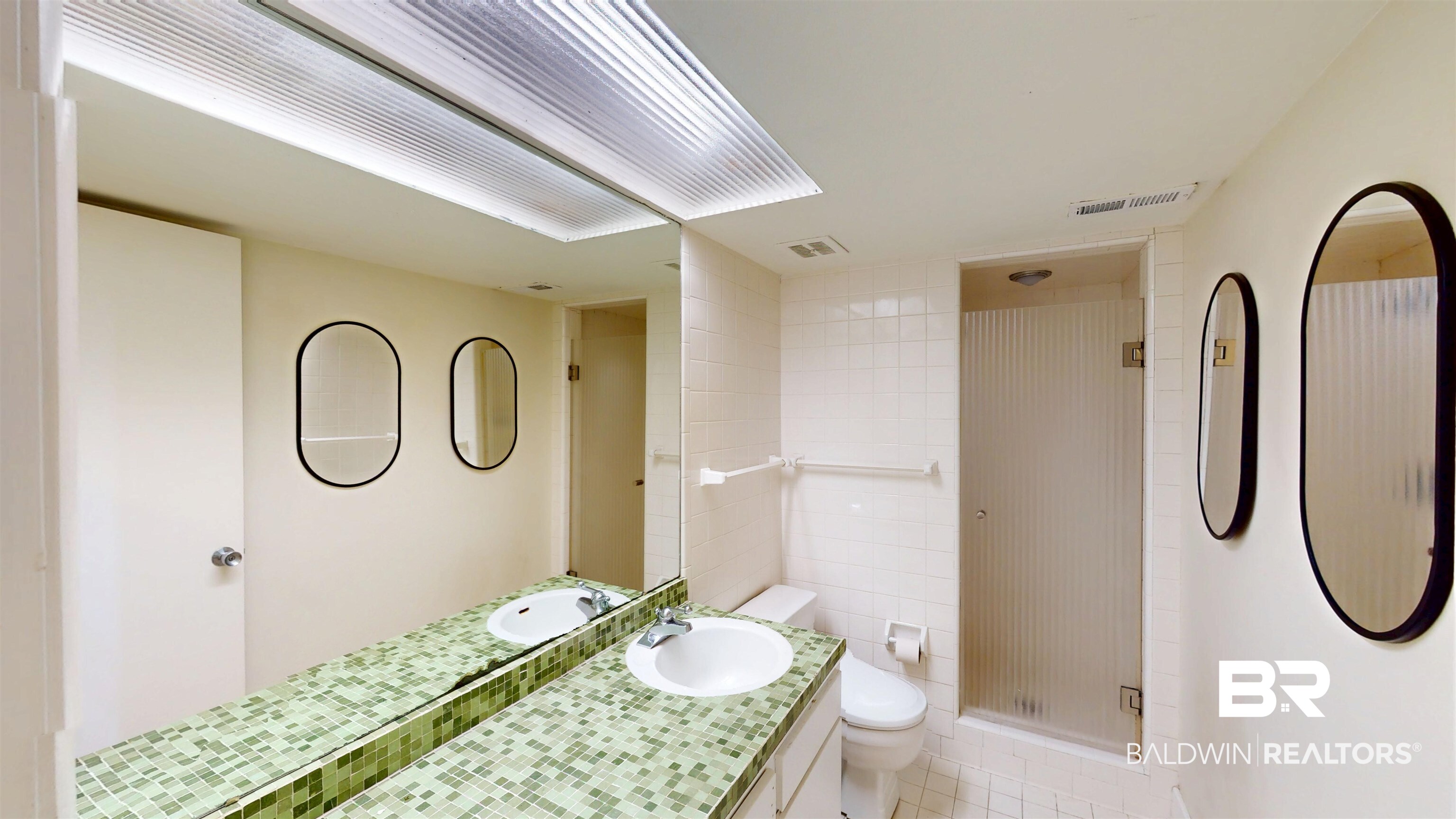 15 Spring Bank Road Mobile, AL 36608 - Photo 34 of 58 Bathroom featuring a stall shower, vanity, and light tile patterned floors
