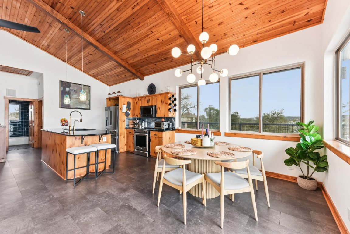 1813 Graveyard Point Road Austin, TX 78734 - Photo 11 of 40 a view of a dining room with furniture window and outside view