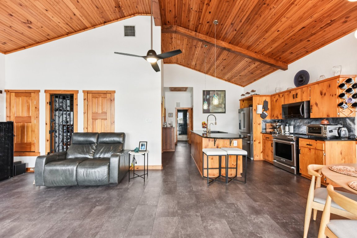 1813 Graveyard Point Road Austin, TX 78734 - Photo 15 of 40 a living room with furniture and kitchen view