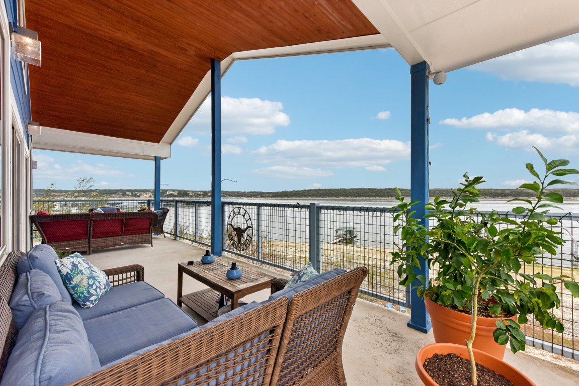 1813 Graveyard Point Road Austin, TX 78734 - Photo 16 of 40 a balcony with furniture and a potted plant