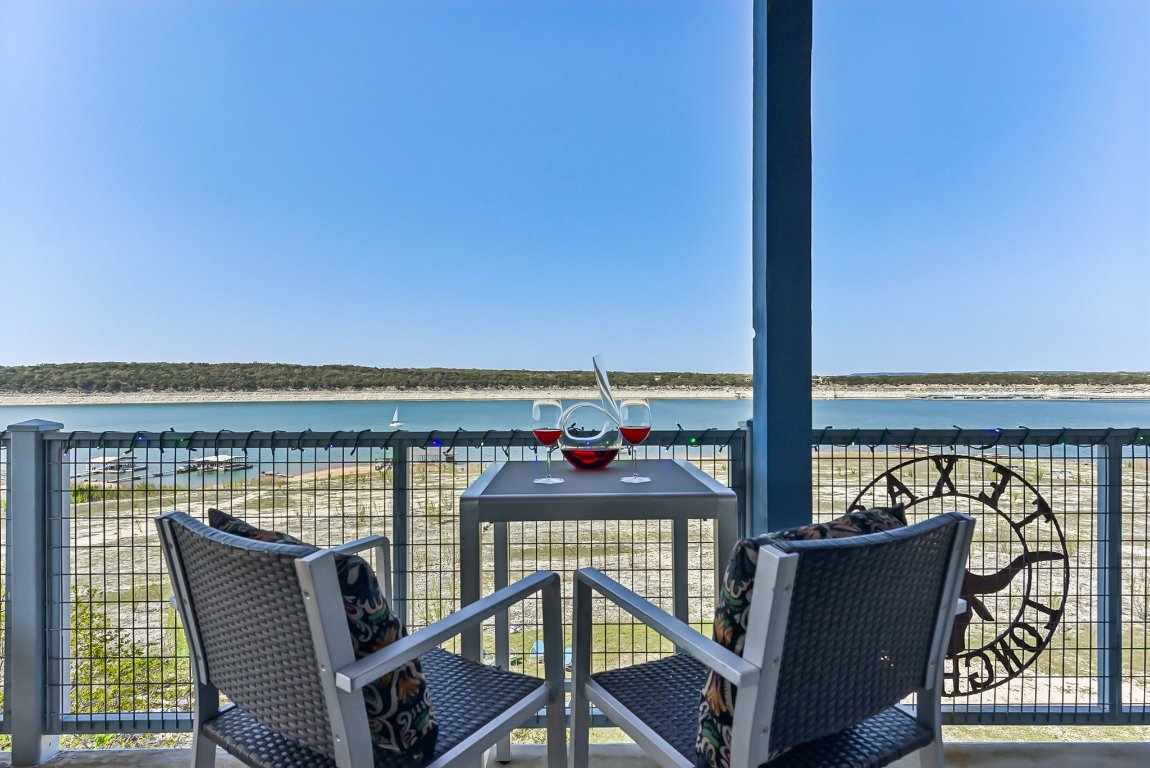 1813 Graveyard Point Road Austin, TX 78734 - Photo 19 of 40 a view of a balcony with chair and wooden floor