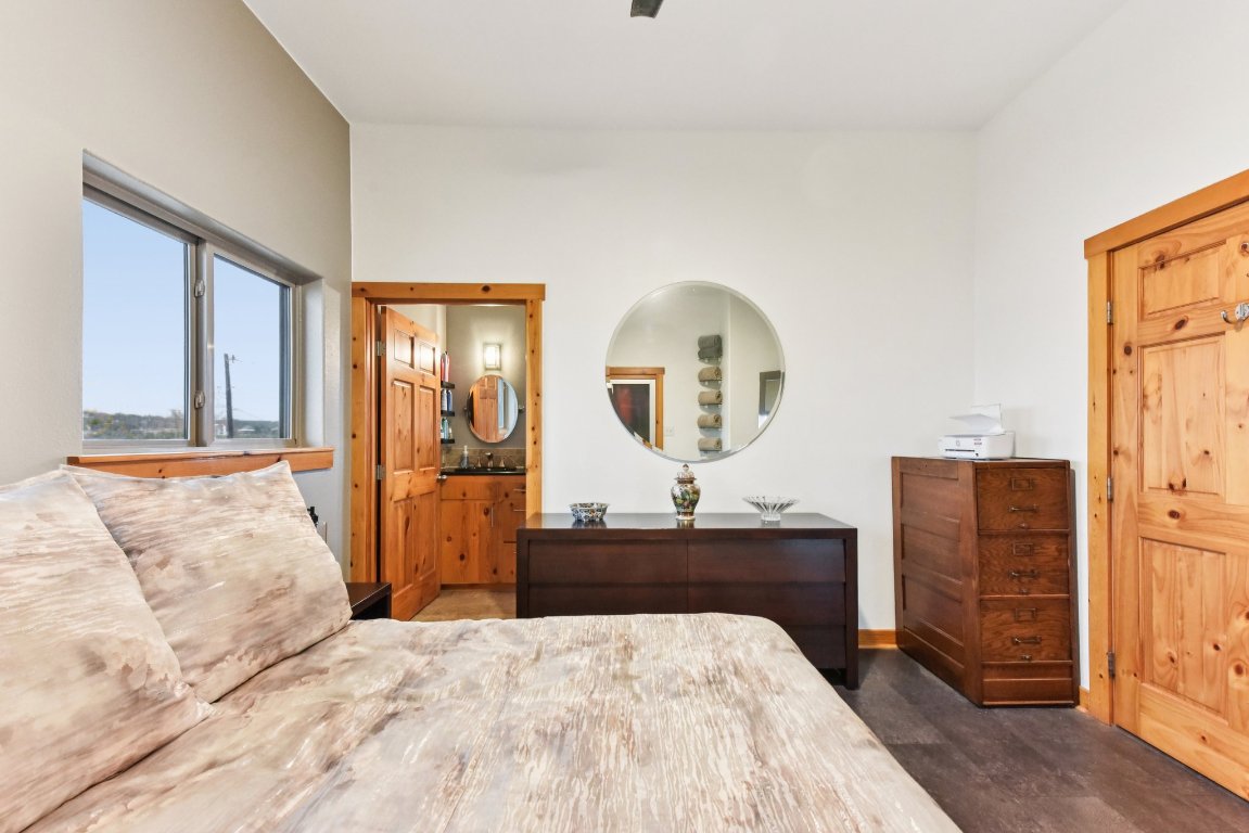 1813 Graveyard Point Road Austin, TX 78734 - Photo 20 of 40 a bedroom with a bed and a dresser