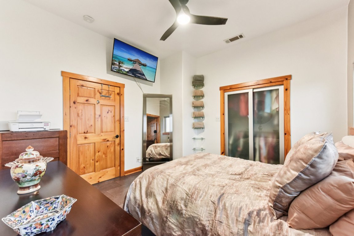 1813 Graveyard Point Road Austin, TX 78734 - Photo 21 of 40 a bedroom with bed and wooden floor