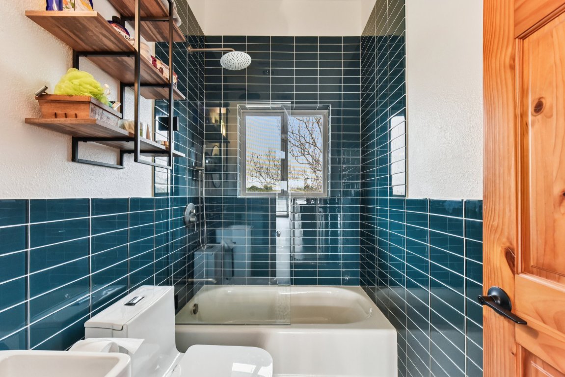 1813 Graveyard Point Road Austin, TX 78734 - Photo 27 of 40 a bathroom with a sink toilet and shower