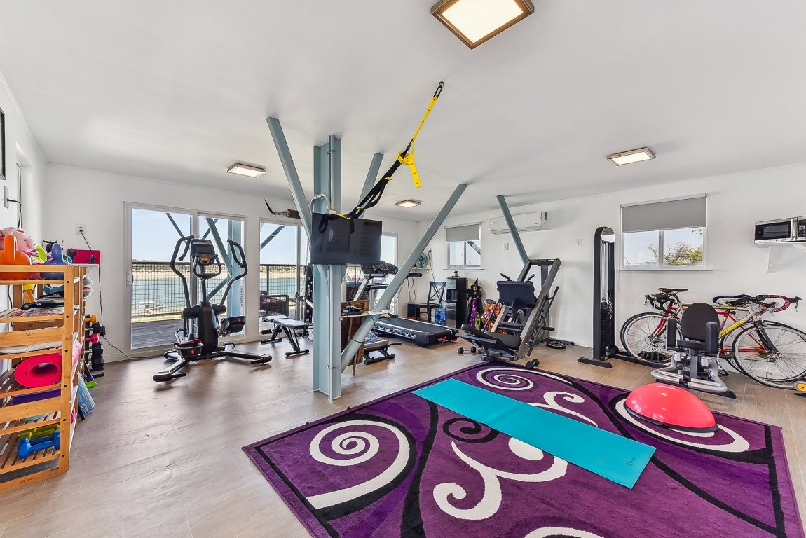 1813 Graveyard Point Road Austin, TX 78734 - Photo 28 of 40 a view of a room with gym equipment
