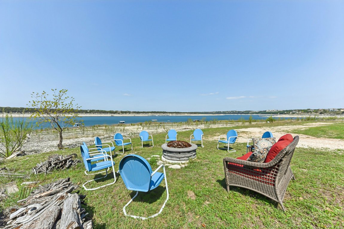 1813 Graveyard Point Road Austin, TX 78734 - Photo 30 of 40 a roof deck with couple of chairs and a table