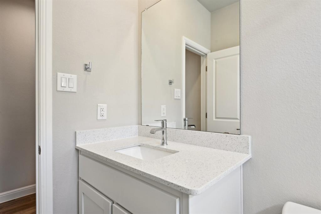 1504 Rachel Street Northlake, TX 76247 - Photo 22 of 40 a bathroom with a sink and a mirror