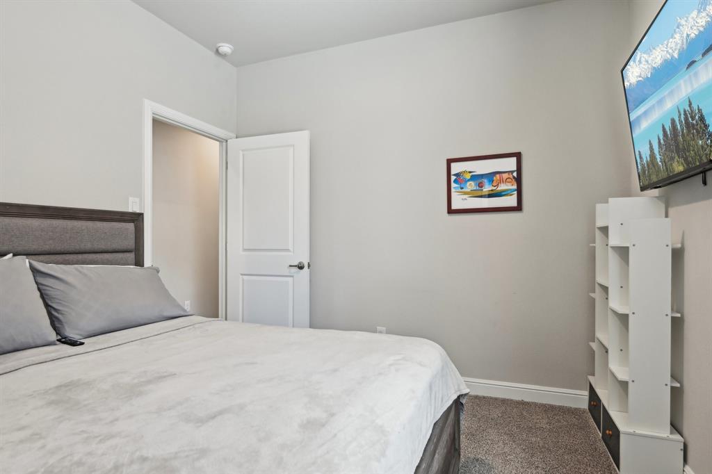 1504 Rachel Street Northlake, TX 76247 - Photo 24 of 40 a bedroom with a bed and a painting on the wall