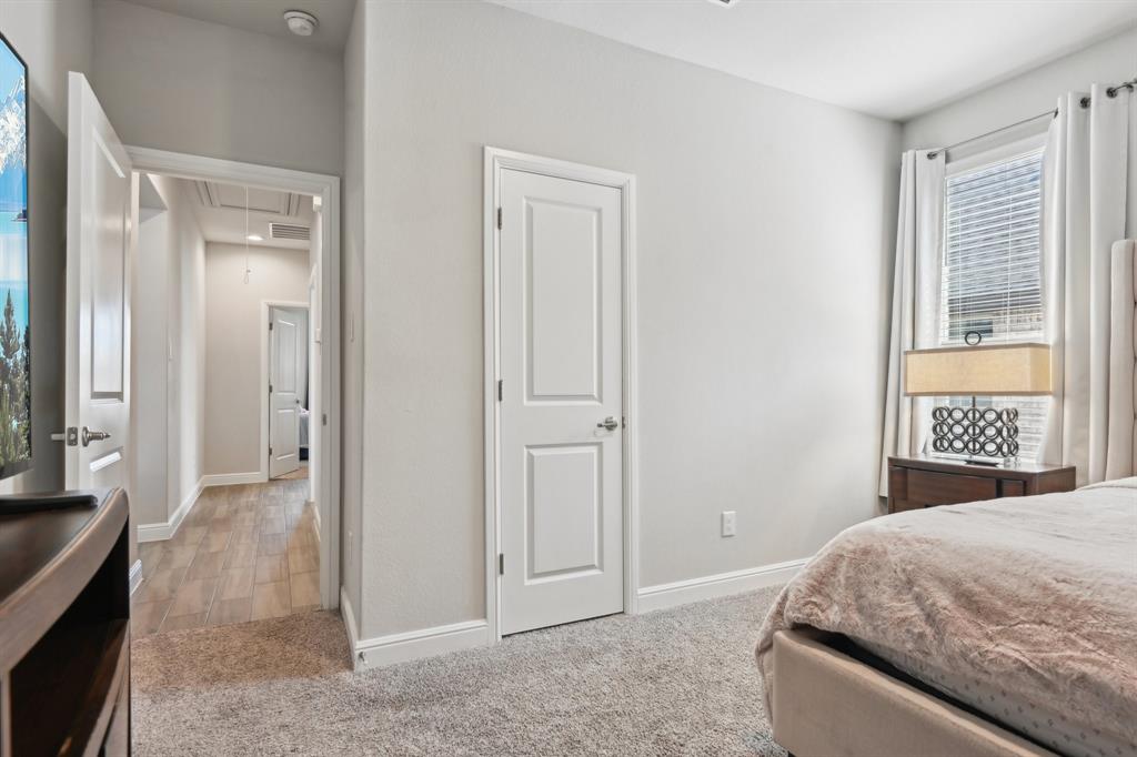 1504 Rachel Street Northlake, TX 76247 - Photo 26 of 40 a spacious bedroom with a bed and a window