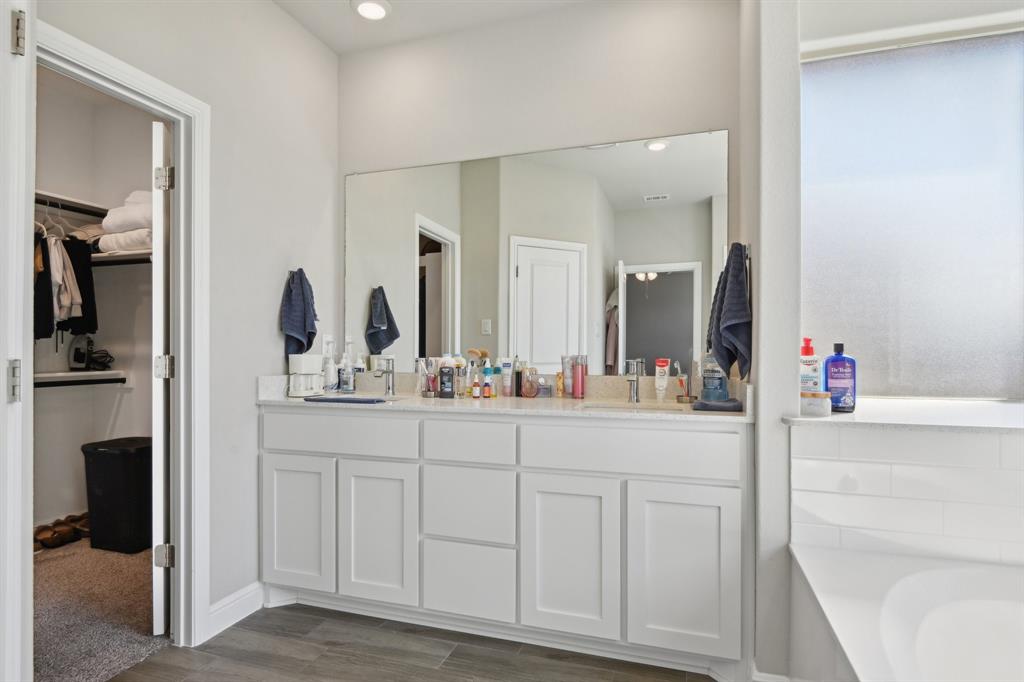 1504 Rachel Street Northlake, TX 76247 - Photo 31 of 40 a bathroom with a sink and a mirror