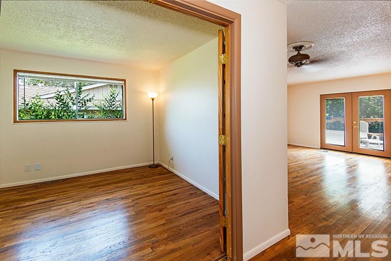 3480 Pierremont Road Reno, NV 89503 - Photo 16 of 16 wooden floor in an empty room with a window