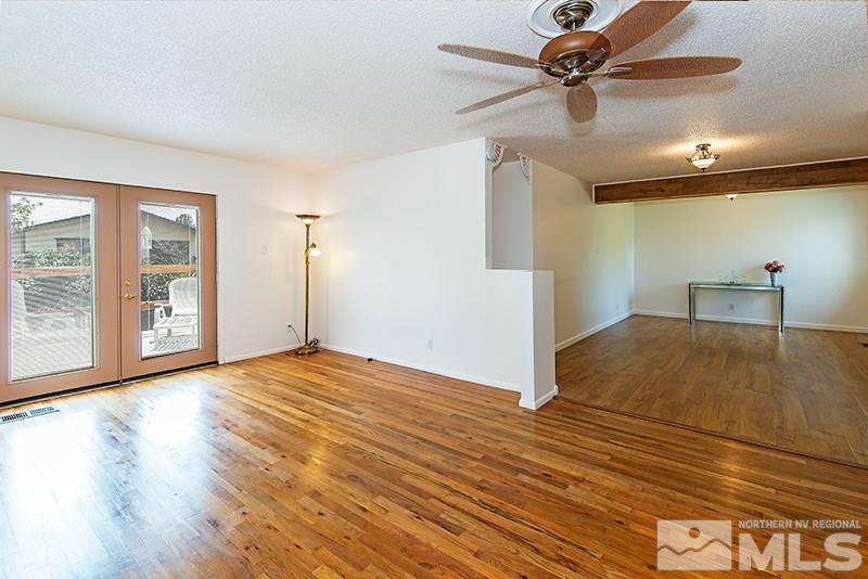 3480 Pierremont Road Reno, NV 89503 - Photo 3 of 16 a view of empty room with wooden floor