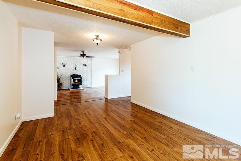 3480 Pierremont Road Reno, NV 89503 - Photo 6 of 16 a view of empty room with wooden floor