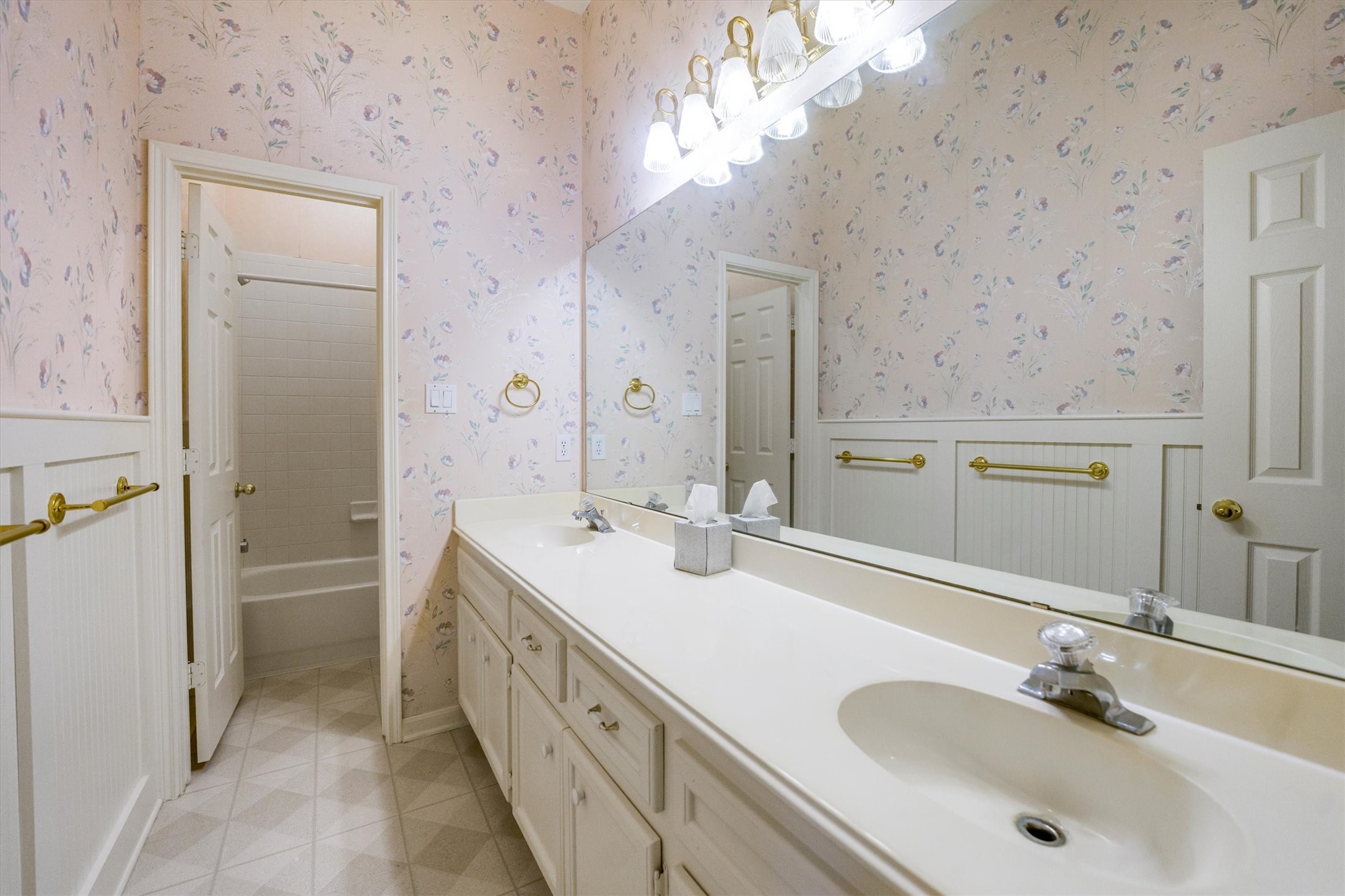 2434 Pebblebrook Circle Conroe, TX 77384 - Photo 30 of 44 a spacious bathroom with double vanity and a mirror