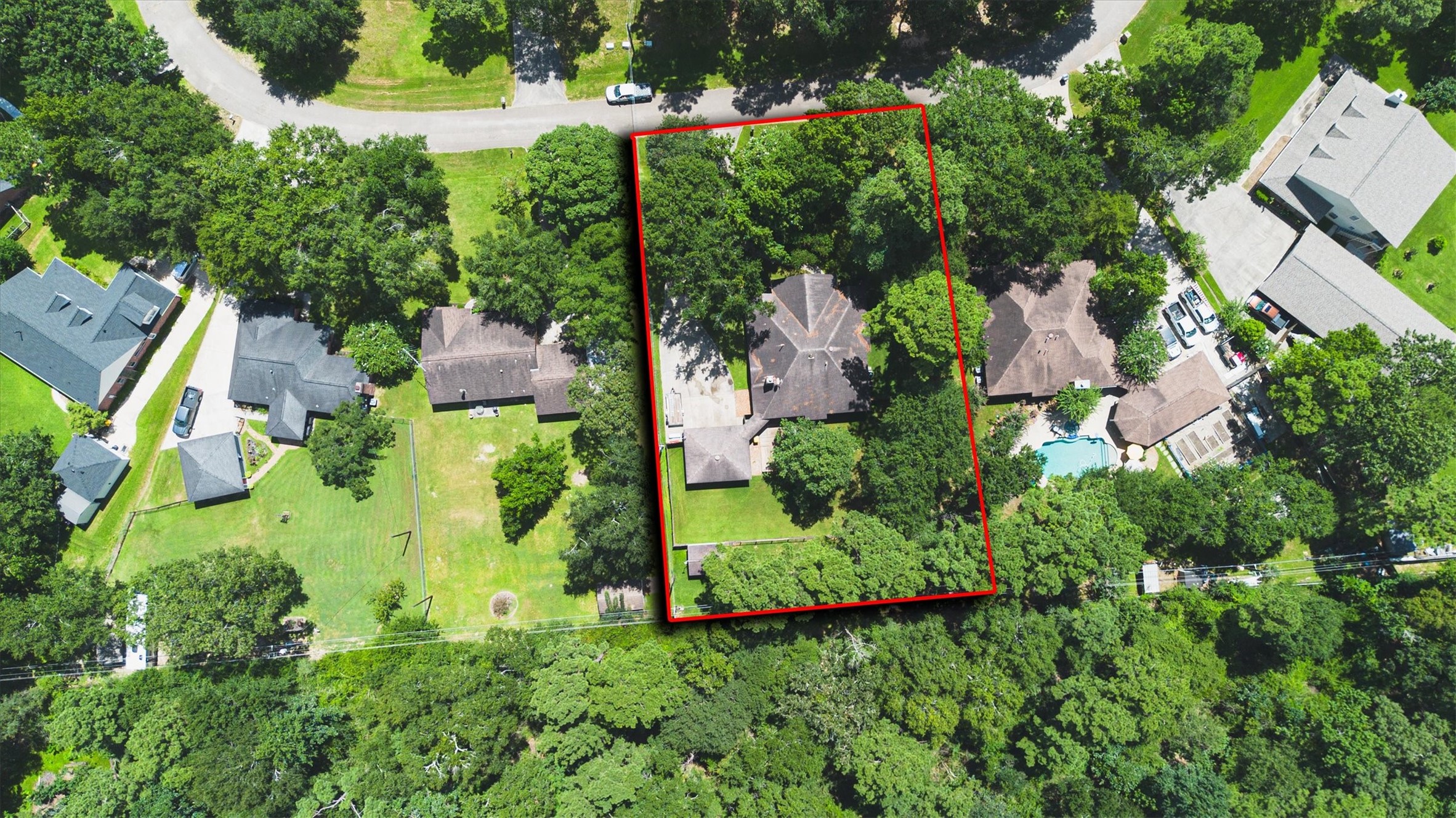 2434 Pebblebrook Circle Conroe, TX 77384 - Photo 43 of 44 an aerial view of residential house with outdoor space and trees all around