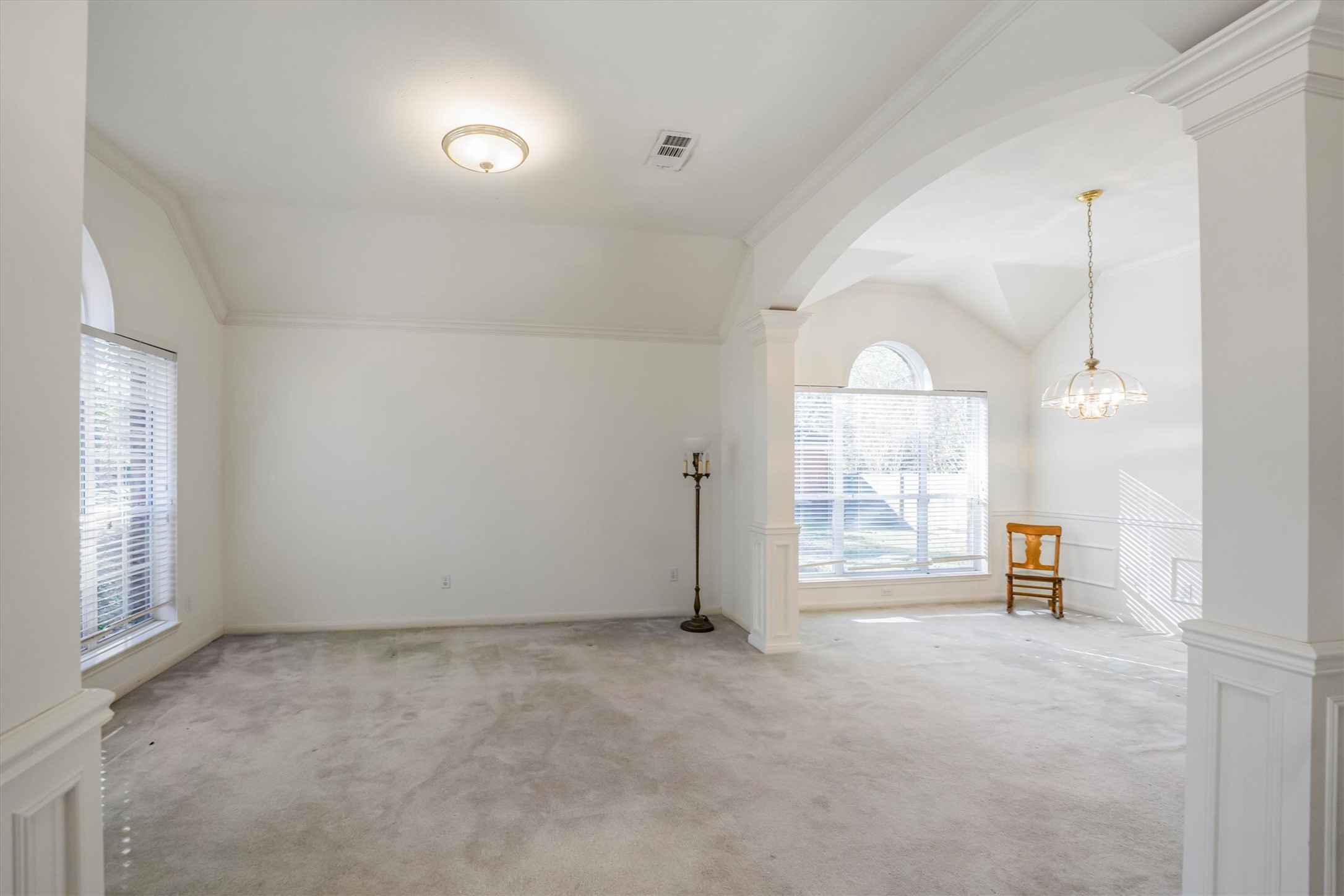 2434 Pebblebrook Circle Conroe, TX 77384 - Photo 9 of 44 an empty room with furniture and windows