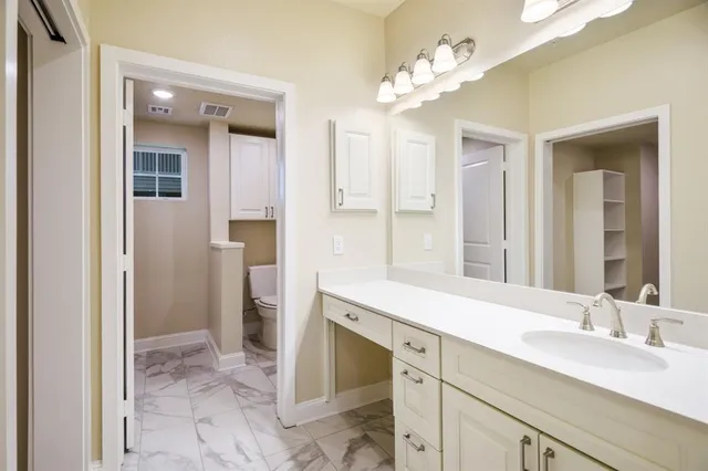 a bathroom with a sink a mirror and a shower