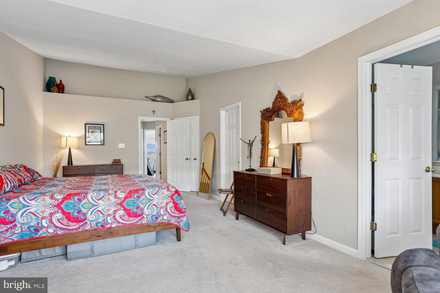2530 Carrington Way Frederick, MD 21702 - Photo 17 of 38 a bedroom with a bed and wooden floor
