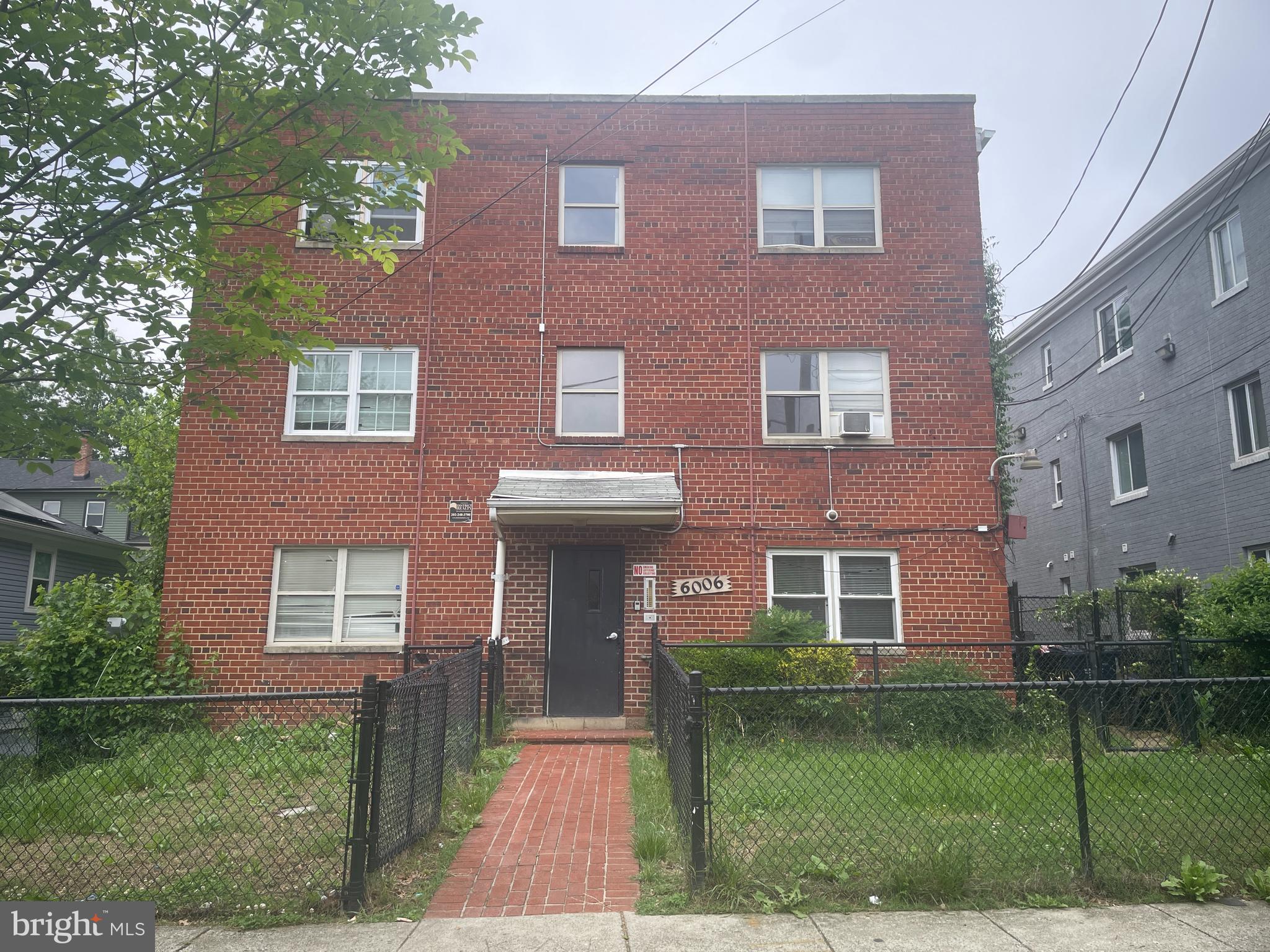 6006 Clay Street Northeast, Unit 102 Washington, DC 20019 - Photo 1 of 13 a front view of a house