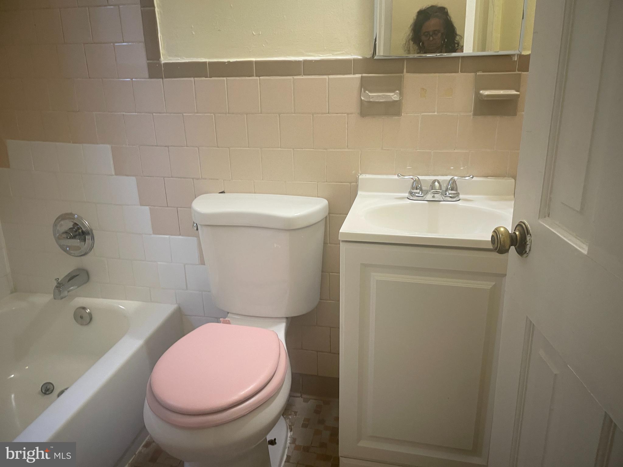 6006 Clay Street Northeast, Unit 102 Washington, DC 20019 - Photo 11 of 13 a bathroom with a sink a toilet and bathtub