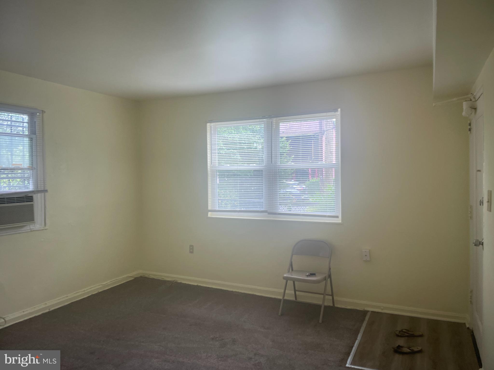6006 Clay Street Northeast, Unit 102 Washington, DC 20019 - Photo 2 of 13 an empty room with a window