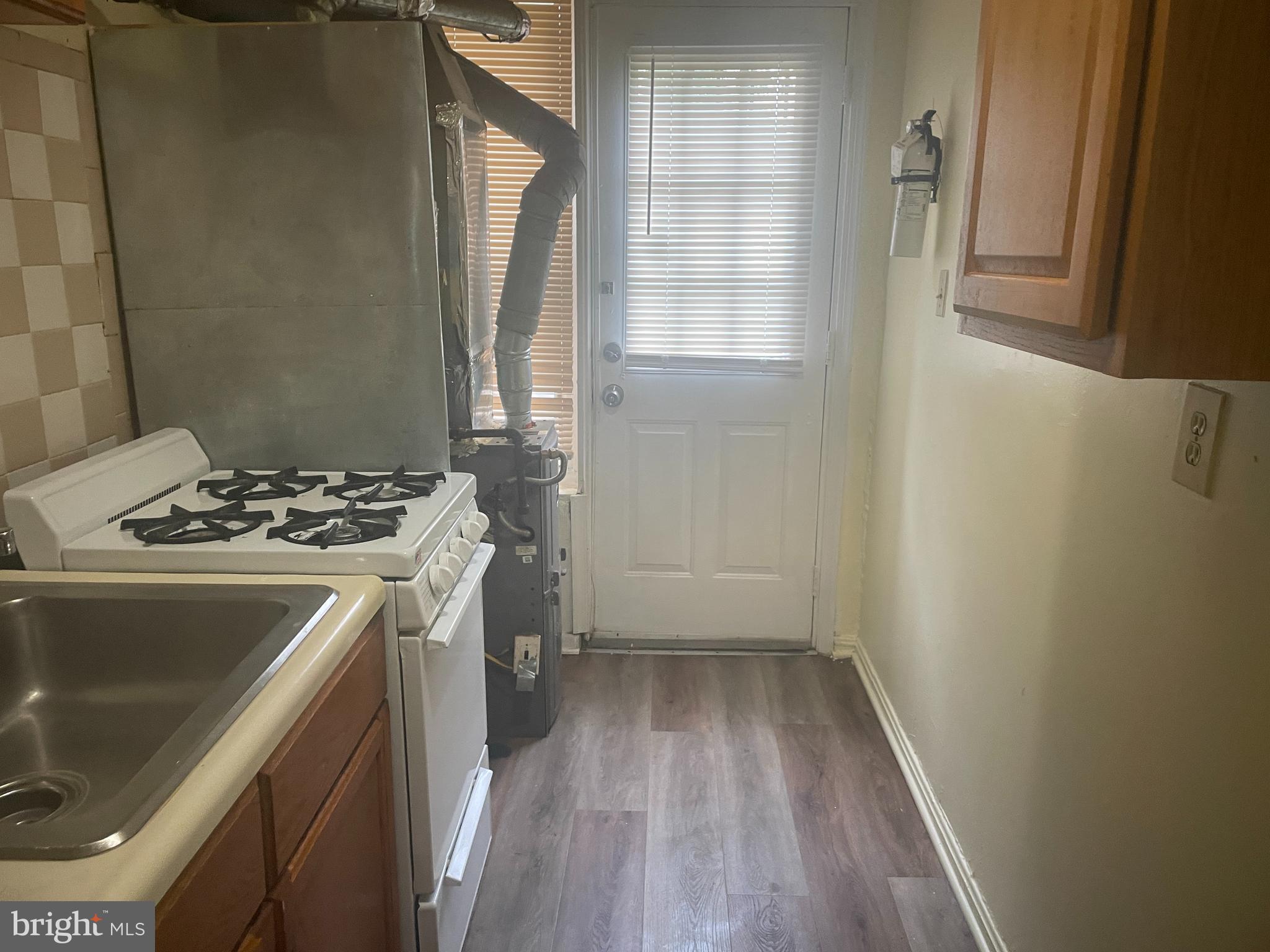 6006 Clay Street Northeast, Unit 102 Washington, DC 20019 - Photo 8 of 13 a view of a storage and utility room with a sink