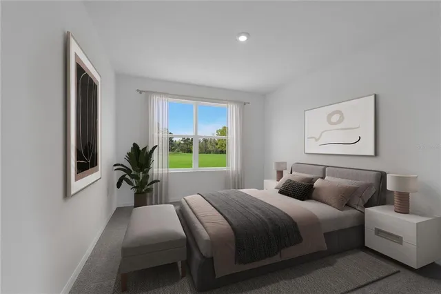 a bedroom with bed and large windows