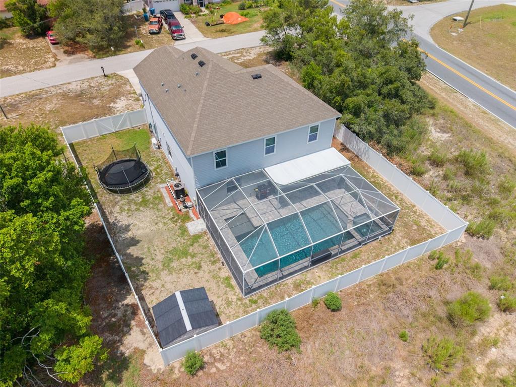 7242 Landmark Drive Spring Hill, FL 34606 - Photo 3 of 45 view of a house with a backyard