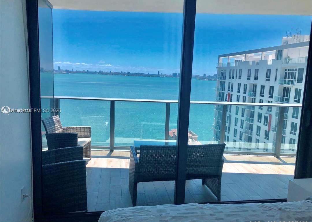 460 Northeast 28th Street, Unit 1907 Miami, FL 33137 - Photo 6 of 7 a view of a balcony with chairs