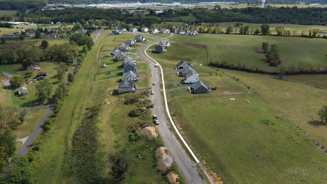 an aerial view of a residential houses with outdoor space