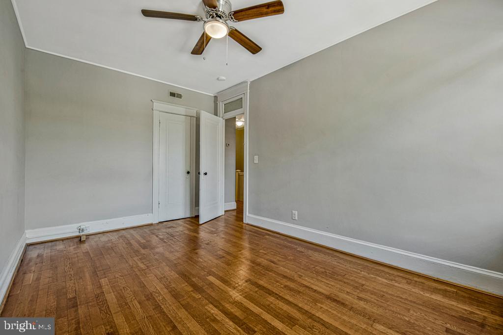 2406 37th Street Northwest Washington, DC 20007 - Photo 34 of 44 wooden floor in an empty room