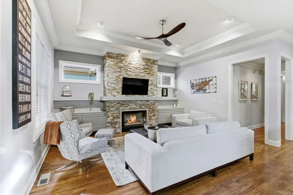 a kitchen with stainless steel appliances kitchen island granite countertop a refrigerator and a stove top oven