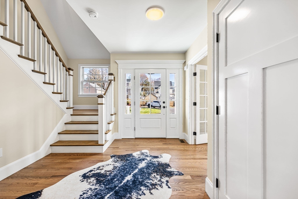 37 Lantern Lane Braintree, MA 02184 - Photo 16 of 40 a view of entryway with wooden floor and stairs
