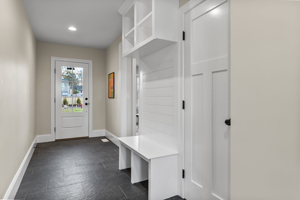 37 Lantern Lane Braintree, MA 02184 - Photo 17 of 40 a view of a hallway with wooden floor and entryway