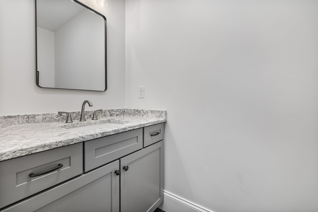 37 Lantern Lane Braintree, MA 02184 - Photo 19 of 40 a bathroom with a granite countertop sink and a mirror