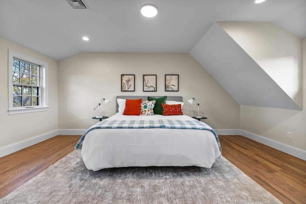 37 Lantern Lane Braintree, MA 02184 - Photo 22 of 40 a bedroom with a bed and wooden floor