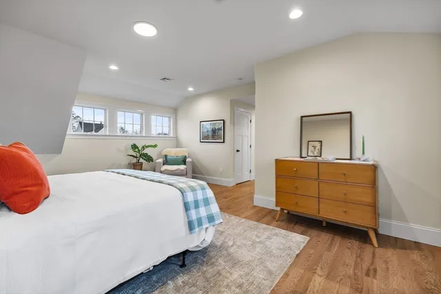 a bedroom with a bed and a dresser