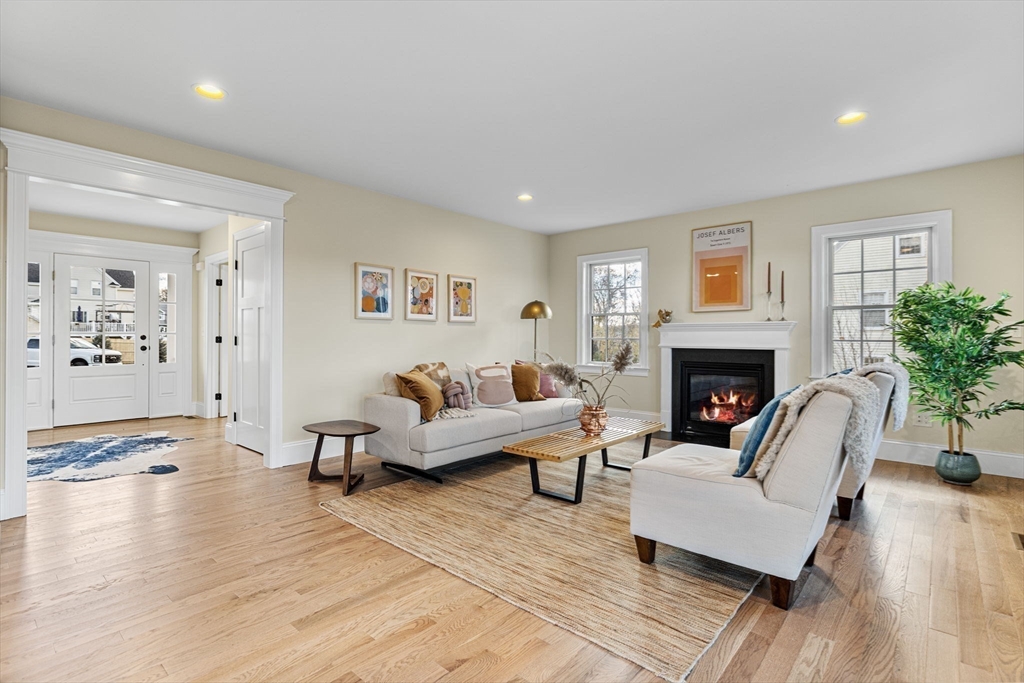 37 Lantern Lane Braintree, MA 02184 - Photo 4 of 40 a living room with furniture and a fireplace