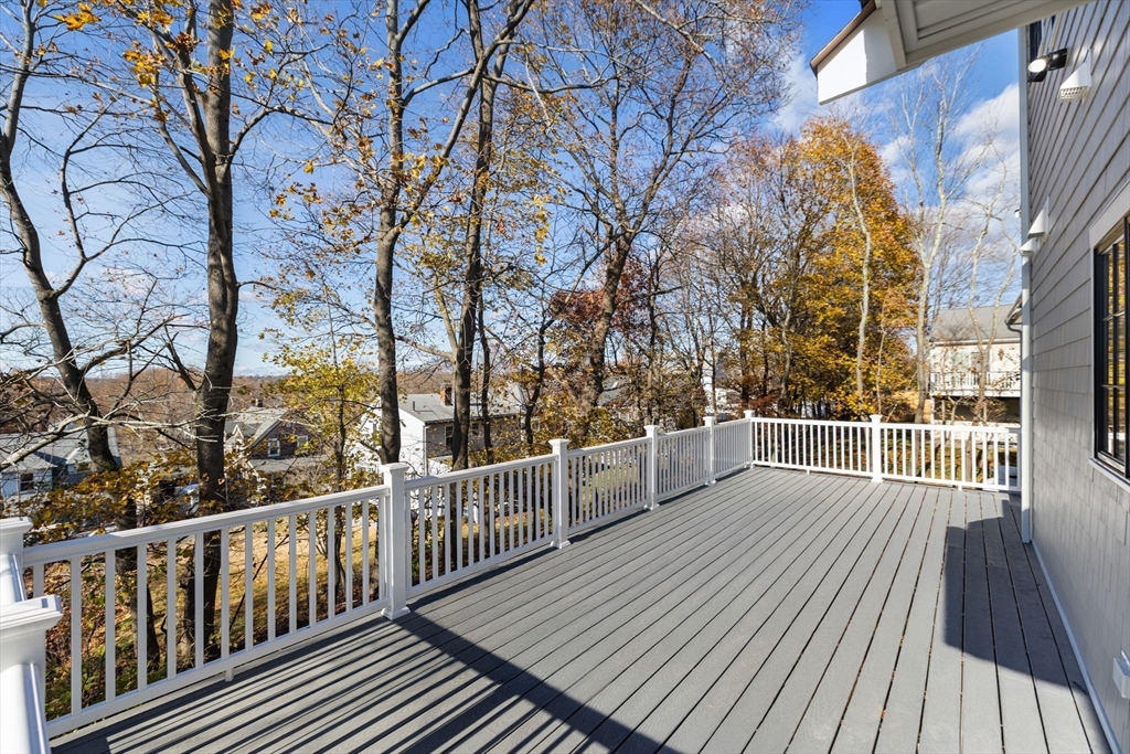 37 Lantern Lane Braintree, MA 02184 - Photo 7 of 40 a view of a balcony with wooden floor and fence
