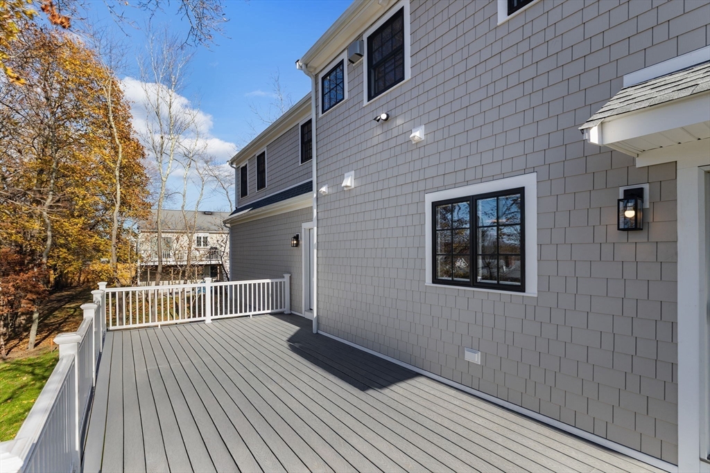 37 Lantern Lane Braintree, MA 02184 - Photo 8 of 40 a view of a balcony with wooden floor