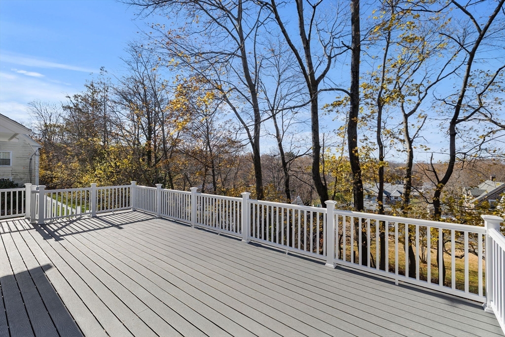 37 Lantern Lane Braintree, MA 02184 - Photo 9 of 40 a terrace view with wooden floor and fence