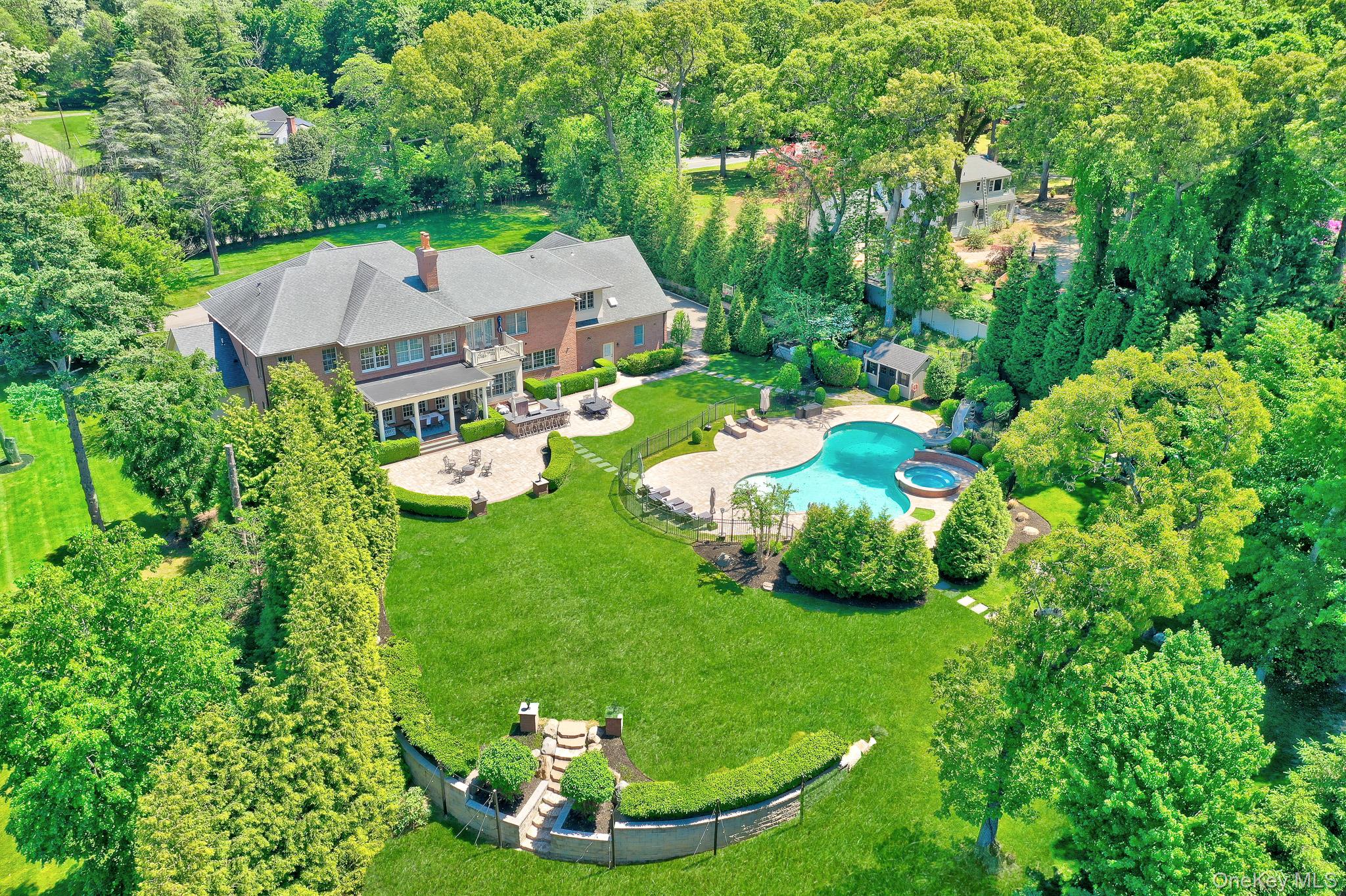 36 Old Field Road Setauket, NY 11733 - Photo 6 of 42 a backyard of a house with garden and outdoor seating