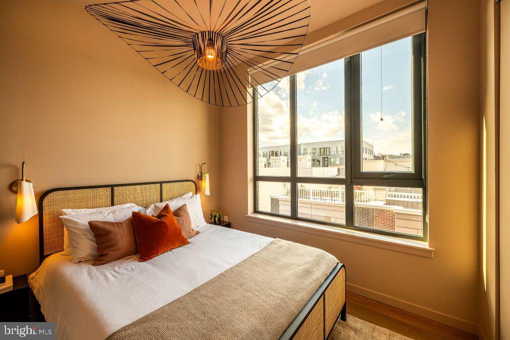 1700 North Front Street, Unit 1B218 Philadelphia, PA 19122 - Photo 12 of 22 a bedroom with a bed and a window