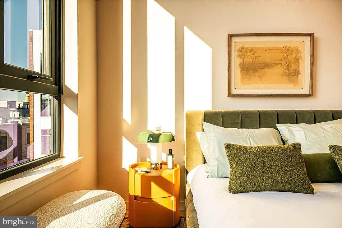 1700 North Front Street, Unit 1B218 Philadelphia, PA 19122 - Photo 19 of 22 a bedroom with a bed and wooden floor