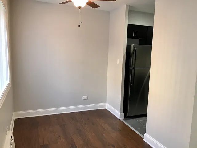 an empty room with wooden floor