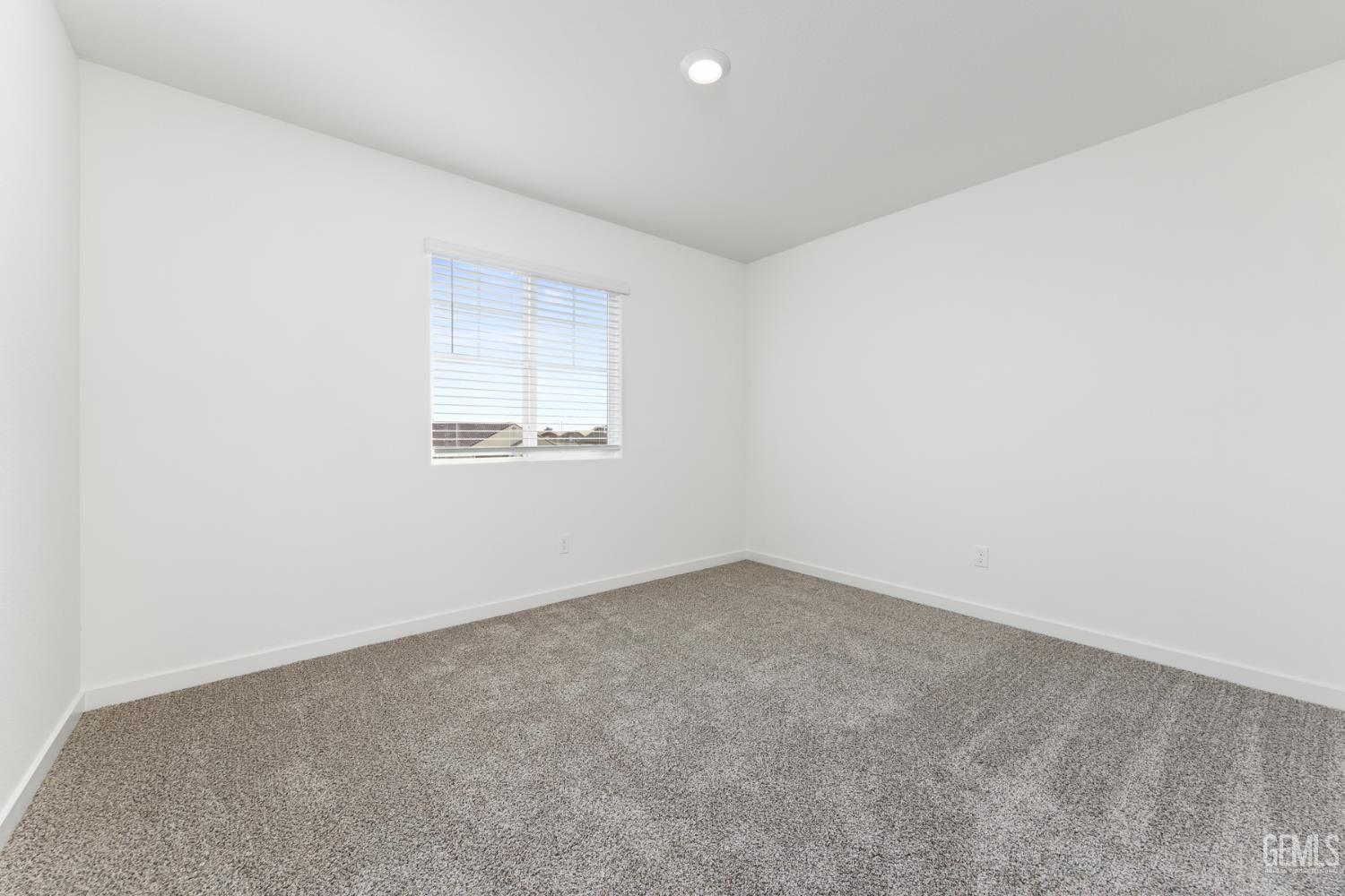 Undisclosed Address Bakersfield, CA 93313 - Photo 4 of 13 an empty room with a window