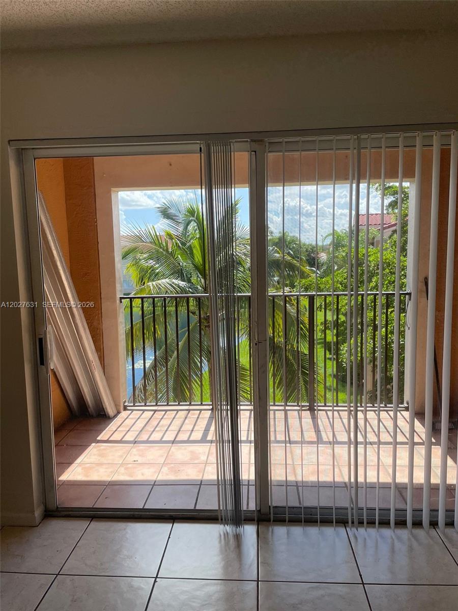 2081 Renaissance Boulevard, Unit 306 Miramar, FL 33025 - Photo 4 of 22 a room view with a floor to ceiling window