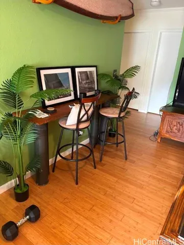 a view of a chairs and table in a backyard