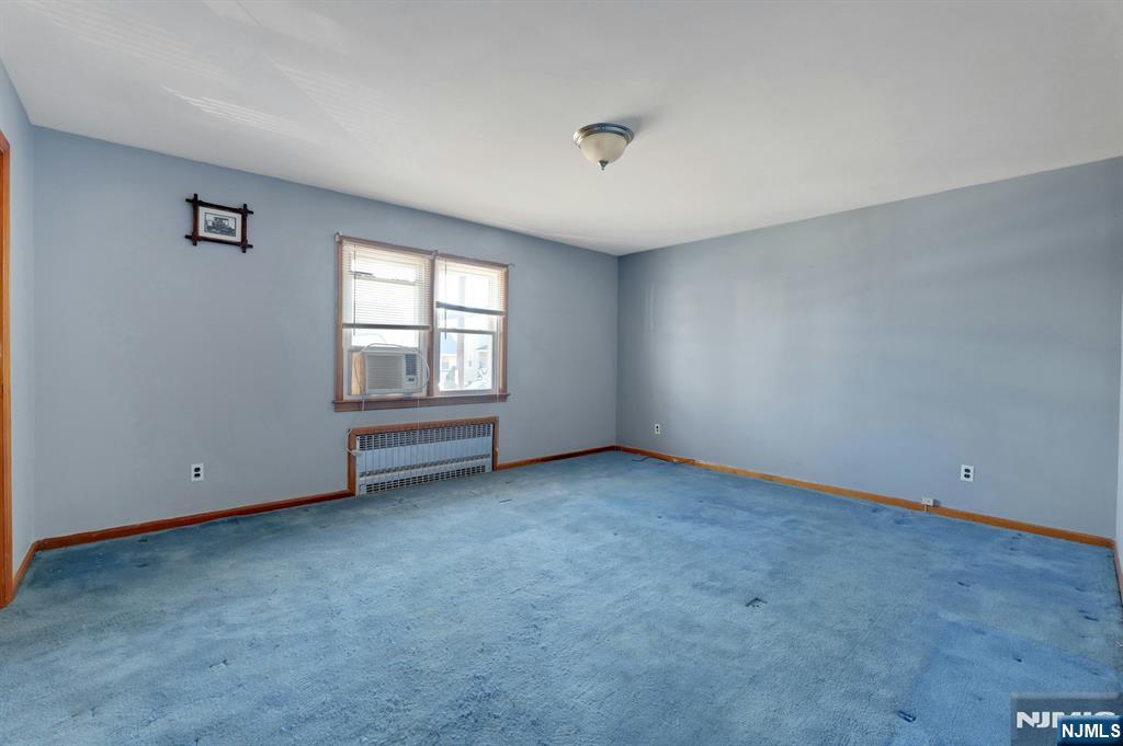 835 Chestnut Street Kearny, NJ 07032 - Photo 13 of 26 an empty room with windows